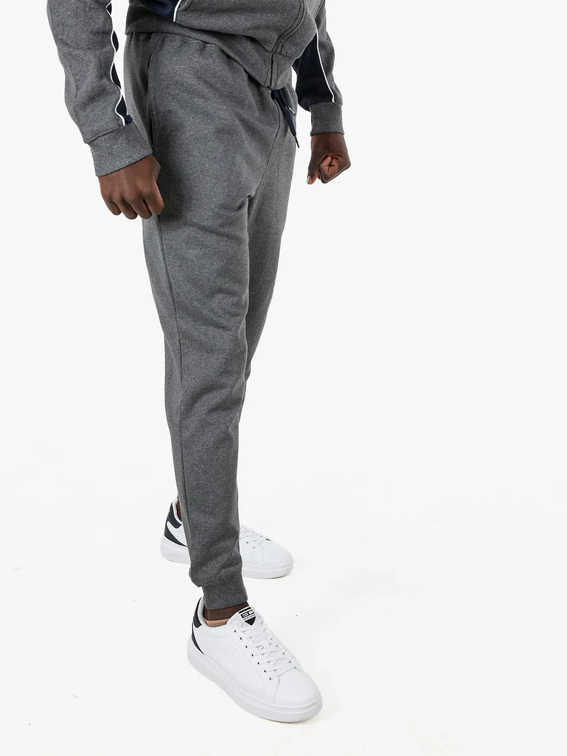 Pantaloni tuta da uomo con coulisse e polsini - grigio