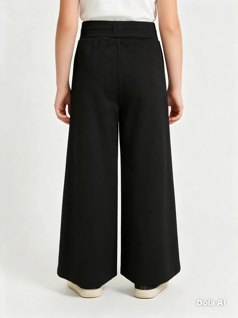 Leggings da bambina effetto ciniglia con finale a zampa - nero