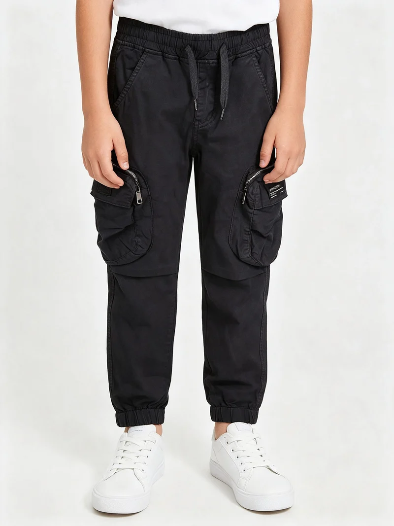 Pantaloni cargo da ragazzo con elastico finale - blu scuro