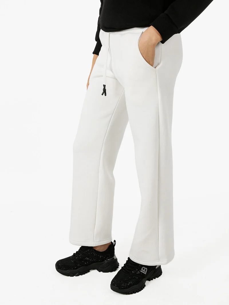 Pantaloni da donna in felpa a gamba larga con coulisse - bianco