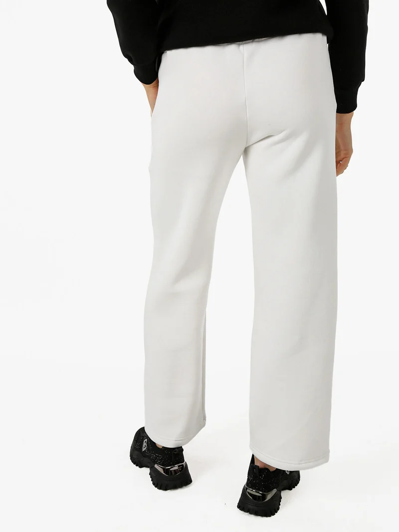 Pantaloni da donna in felpa a gamba larga con coulisse - bianco