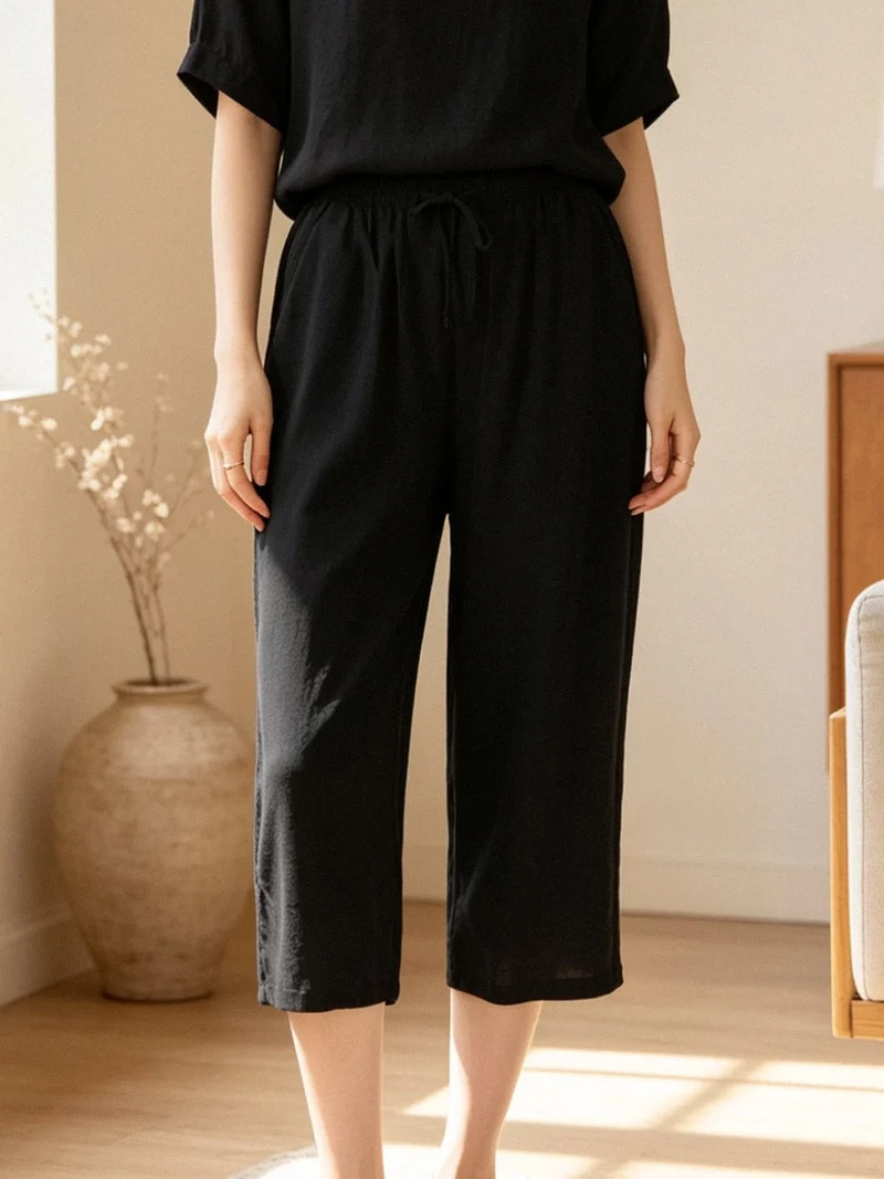 Pantaloni donna cropped a gamba larga con coulisse - nero