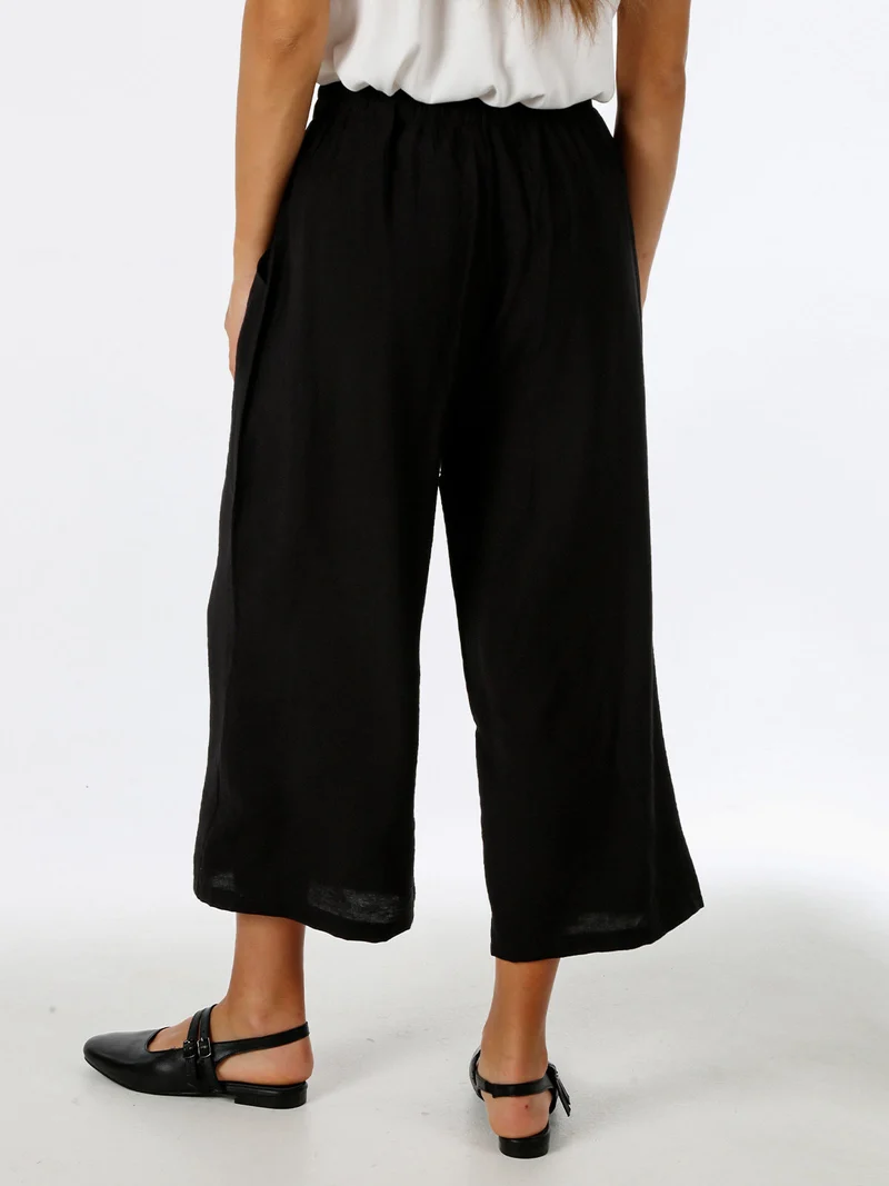 Pantaloni donna cropped a gamba larga con coulisse - nero