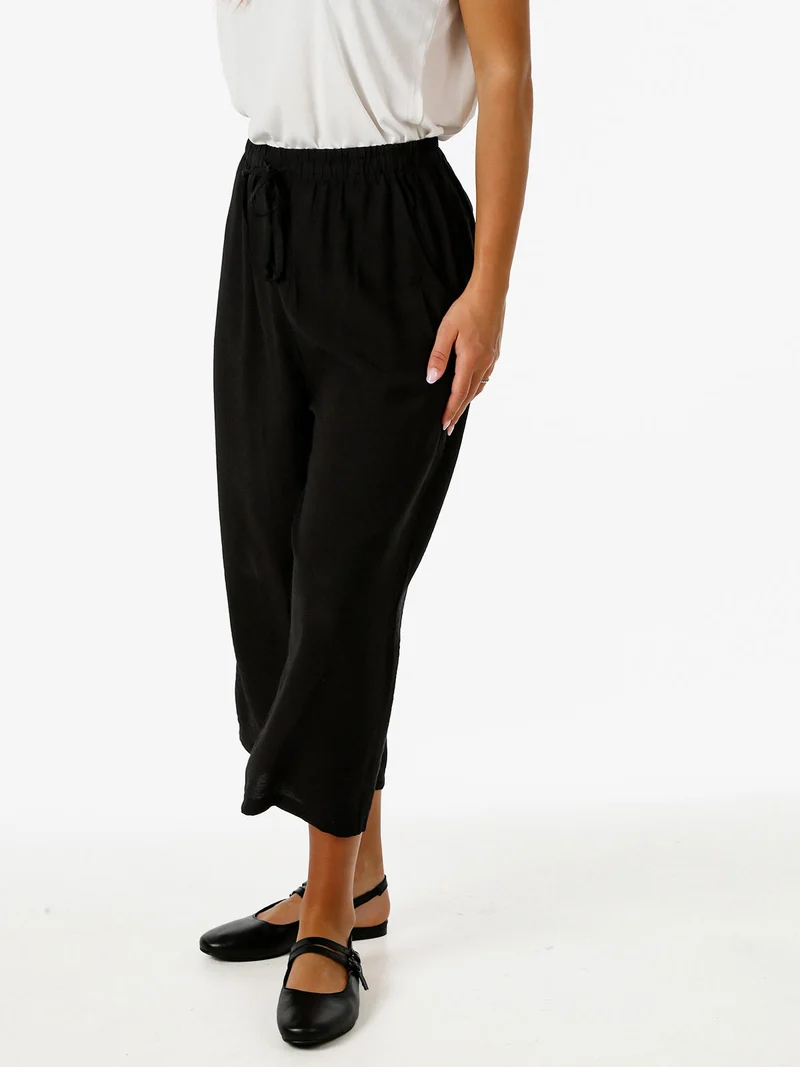 Pantaloni donna cropped a gamba larga con coulisse - nero