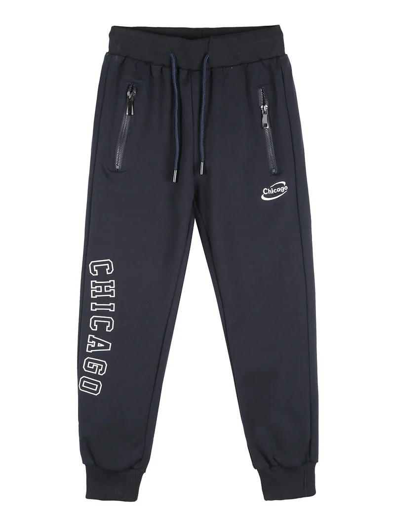 Pantaloni tuta da bambino con polsini e coulisse - blu scuro