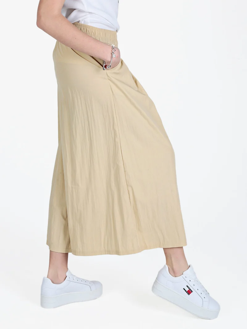 Pantaloni donna cropped a palazzo effetto crespo - beige