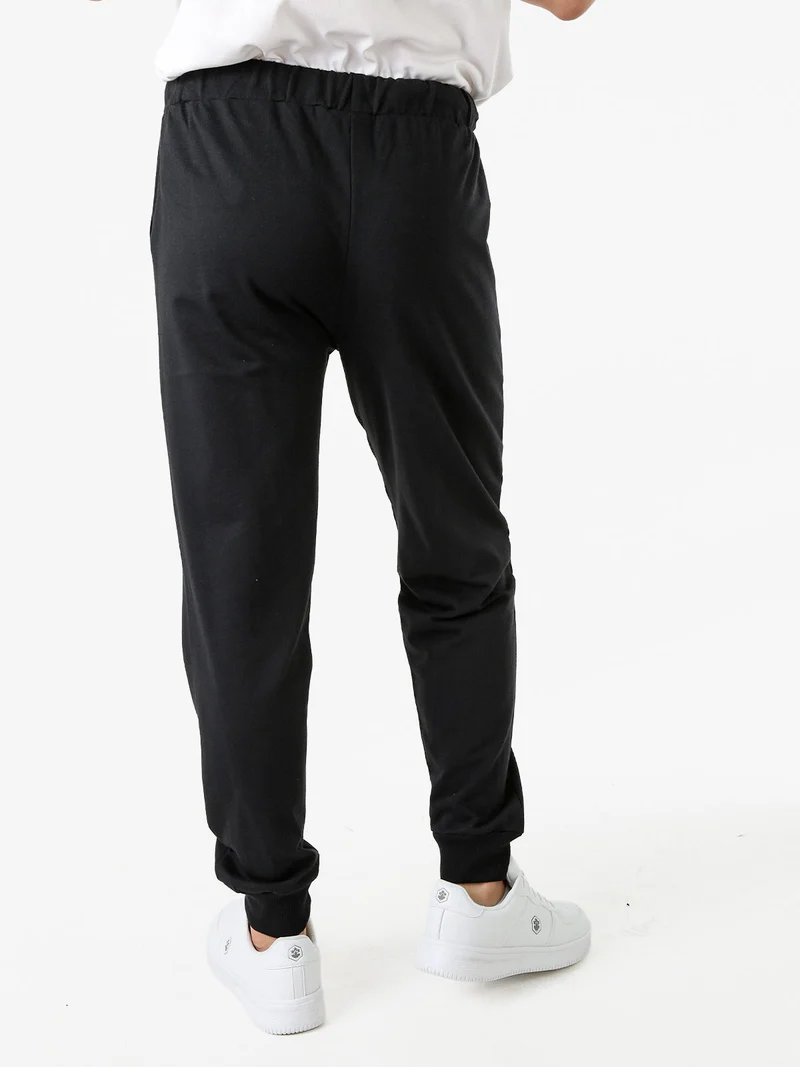 Pantaloni tuta da uomo in felpa con coulisse e polsini - nero
