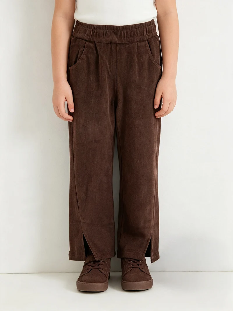 Pantaloni pesanti da bambina con spacco sul finale - marrone