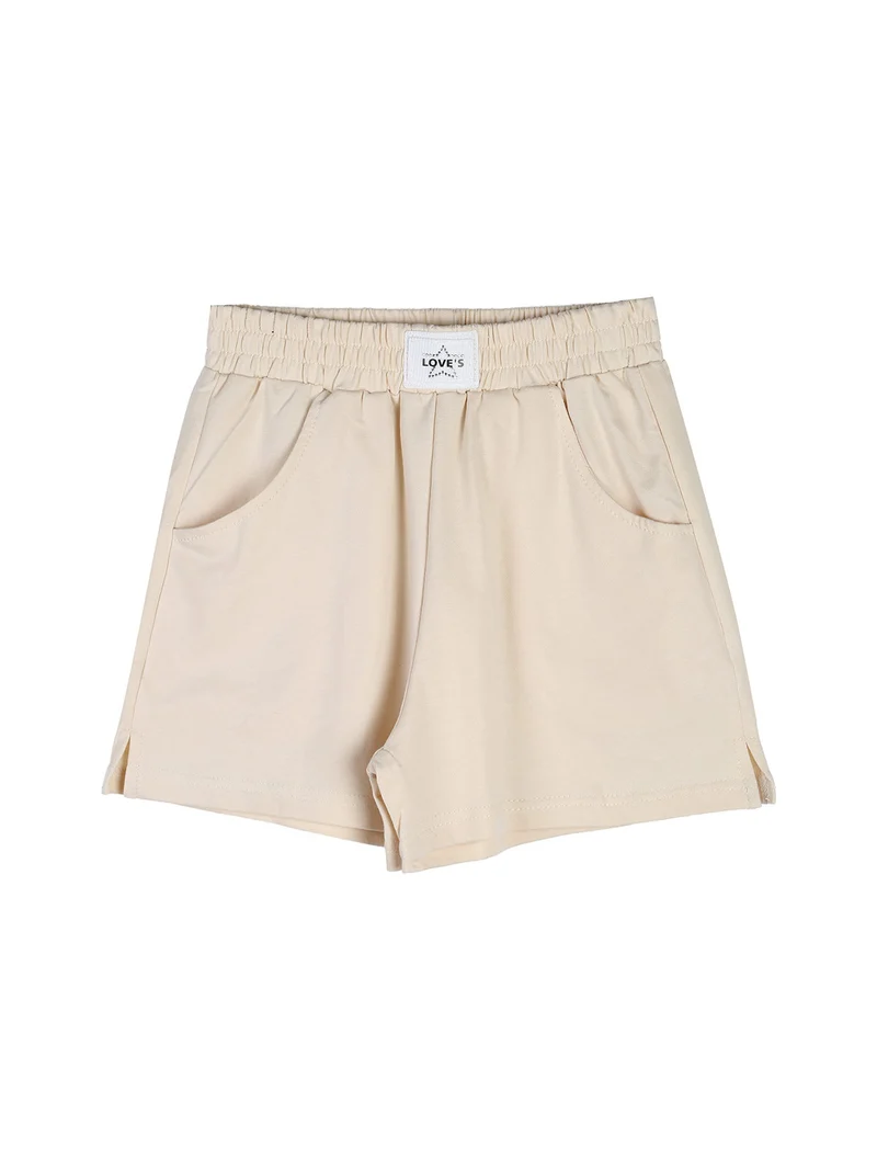 Completo corto da ragazza con top a costine e shorts - beige