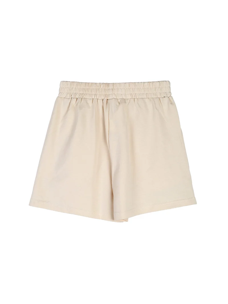 Completo corto da ragazza con top a costine e shorts - beige