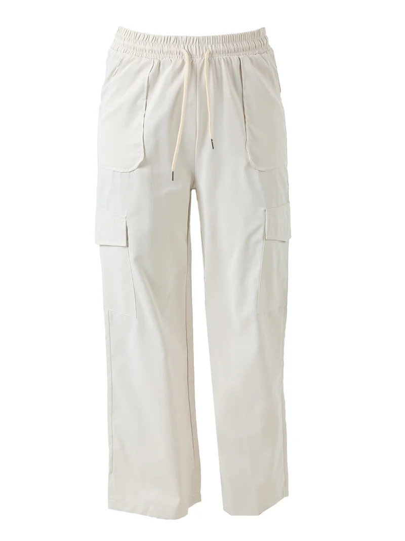 Pantaloni donna a gamba larga con tasconi laterali e coulisse - beige
