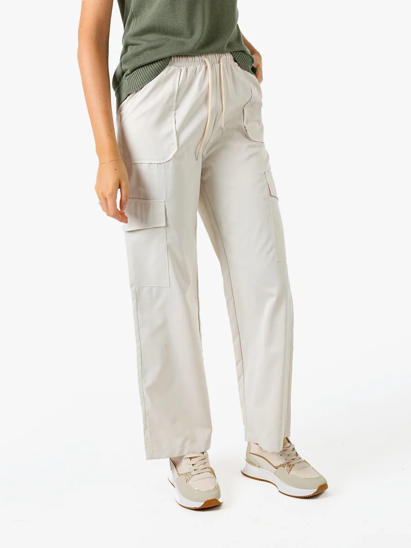 Pantaloni donna a gamba larga con tasconi laterali e coulisse - beige