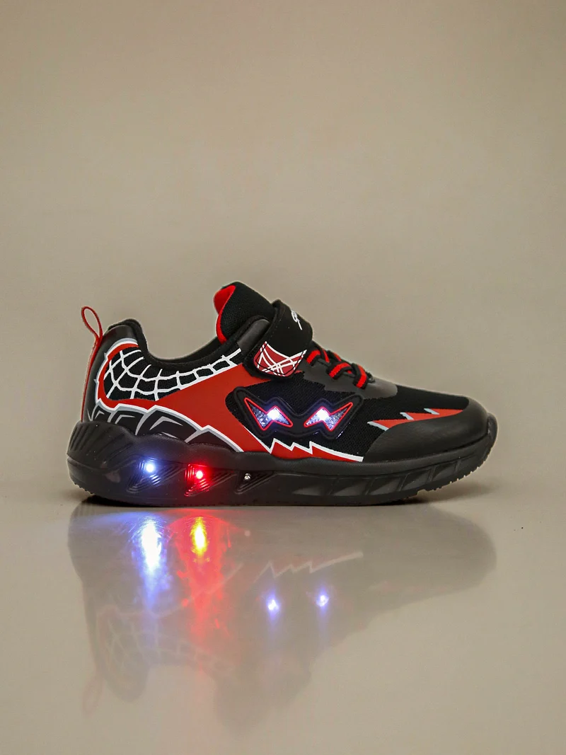 Sneakers da ragazzo con luci e cinturino a strappo - nero