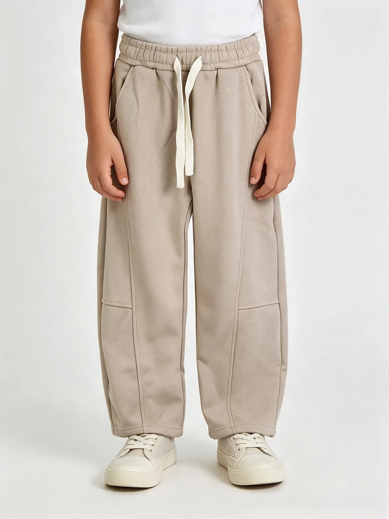 Pantaloni tuta da bambino balloon con interno felpato - beige