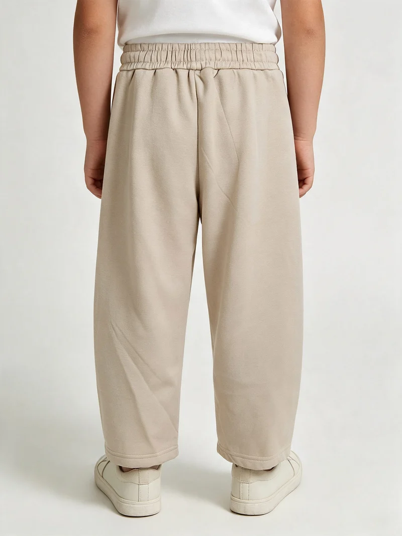 Pantaloni tuta da bambino balloon con interno felpato - beige