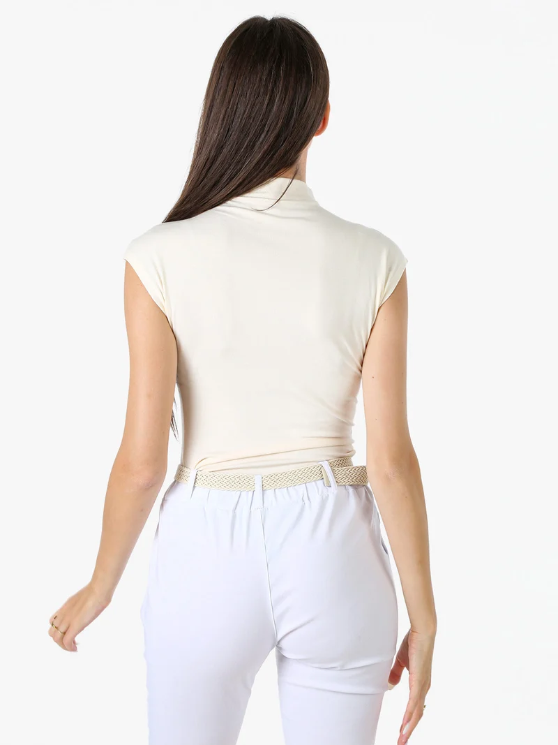 Top donna accollato senza maniche - panna