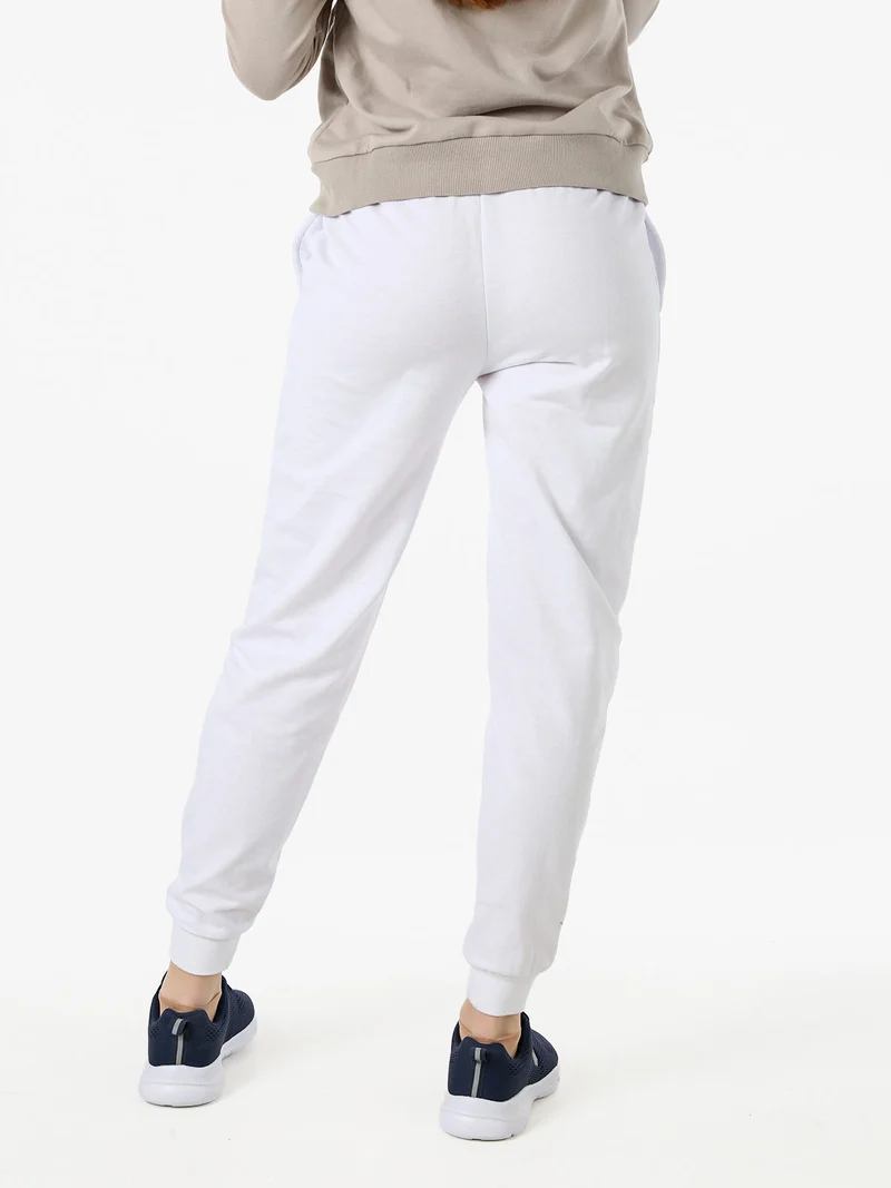 Pantaloni tuta da donna in cotone con coulisse e polsini - bianco