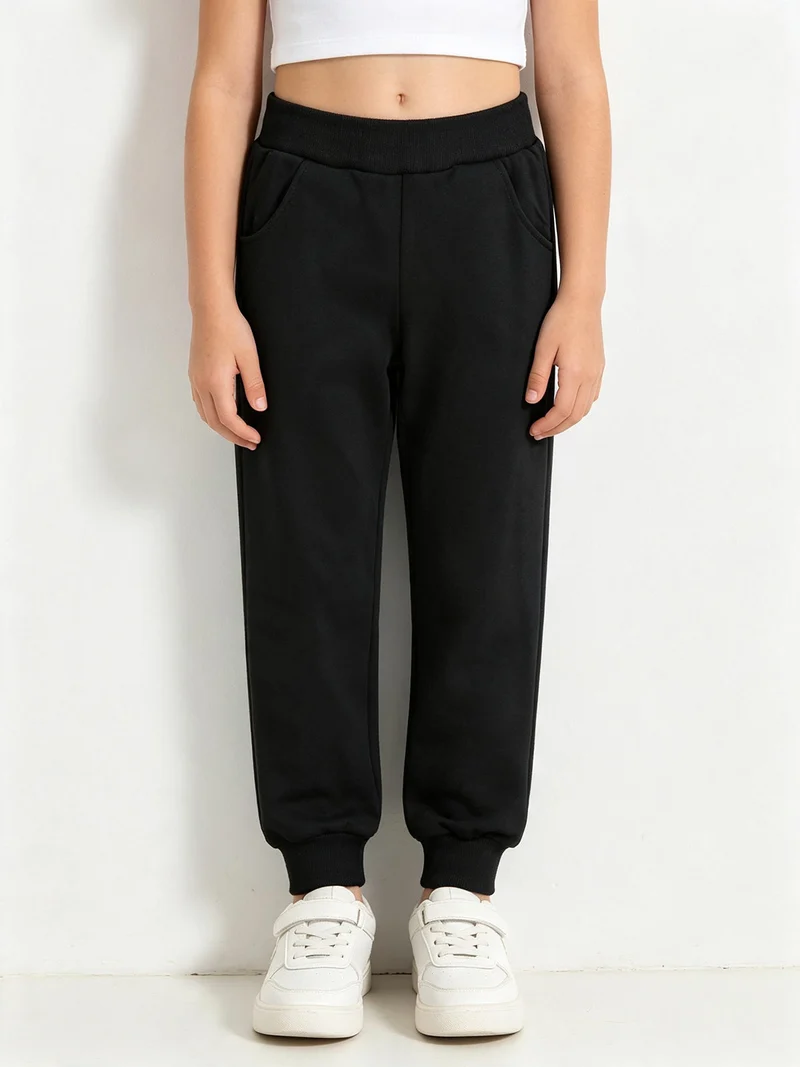 Pantaloni tuta da bambina con polsini - nero