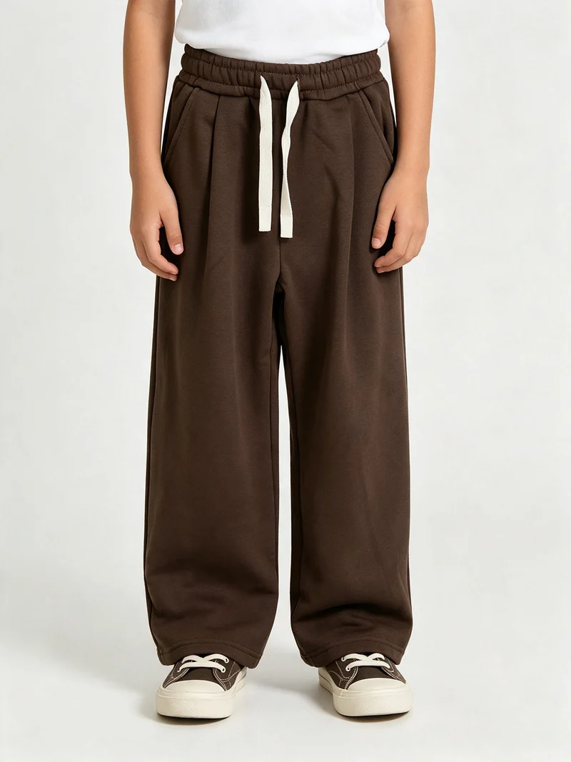 Pantaloni tuta da ragazzo in felpa con coulisse e interno felpato - moro