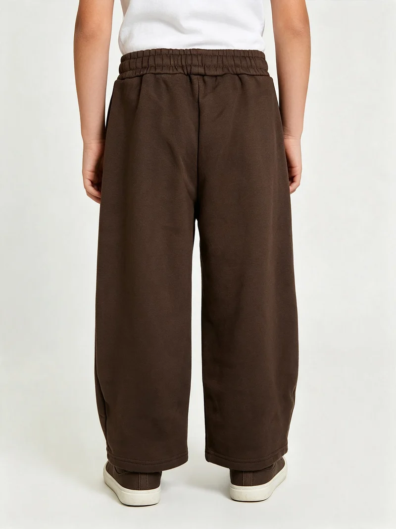 Pantaloni tuta da ragazzo in felpa con coulisse e interno felpato - moro