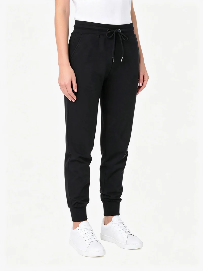 Pantaloni tuta da donna in cotone con coulisse e polsini - nero