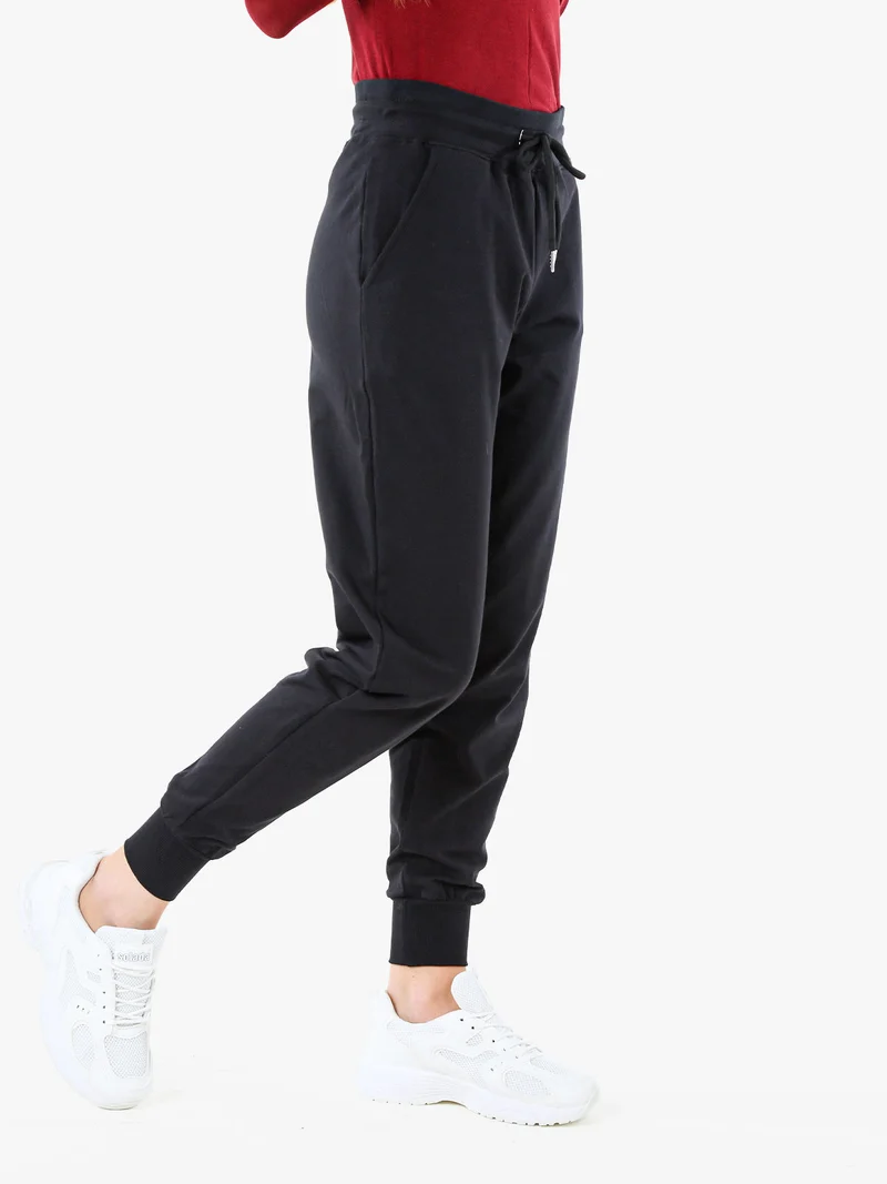 Pantaloni tuta da donna in cotone con coulisse e polsini - nero