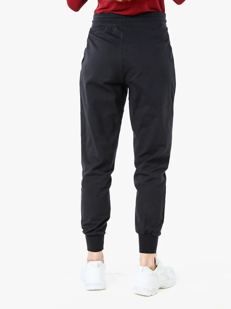 Pantaloni tuta da donna in cotone con coulisse e polsini - nero