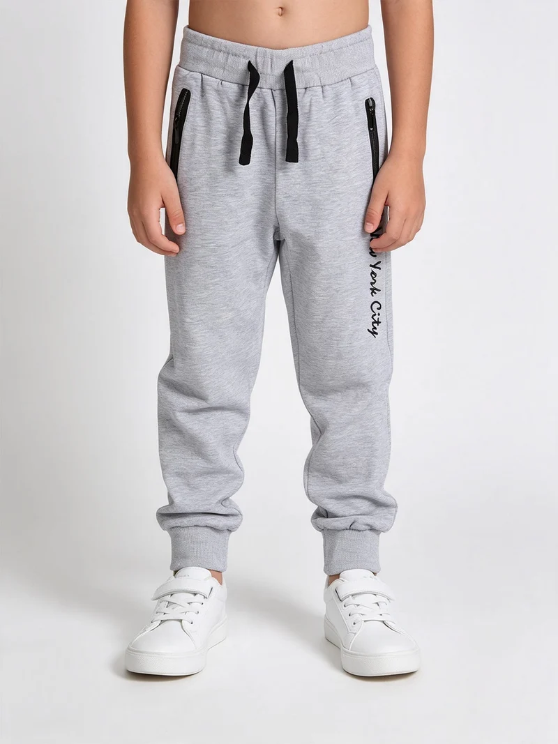 Pantaloni tuta da bambino con polsini - grigio