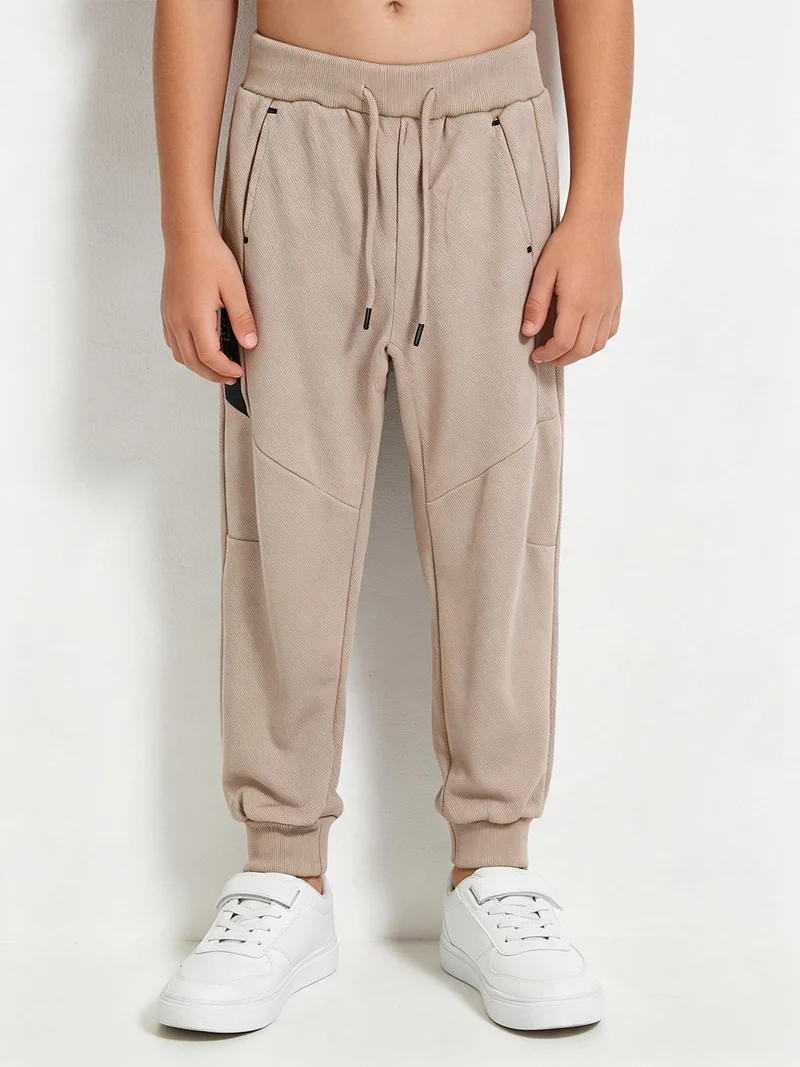 Pantaloni da ragazzo con coulisse e polsini - khaki