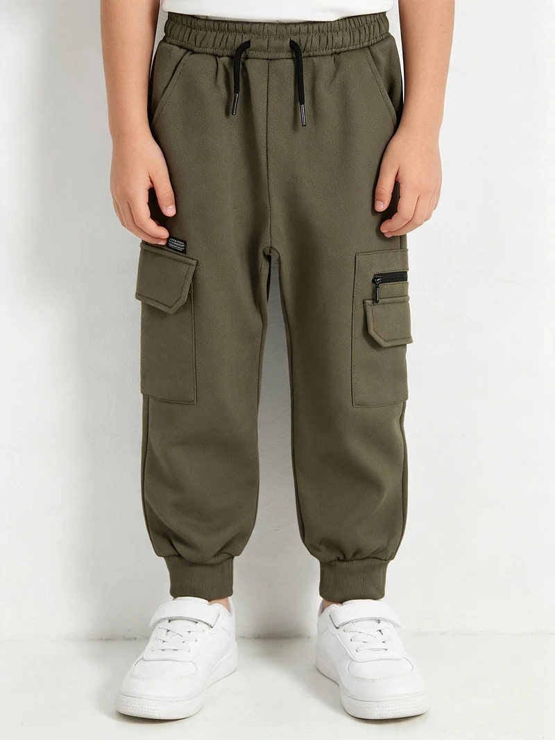 Pantaloni cargo da bambino con polsini e interno felpato - militare