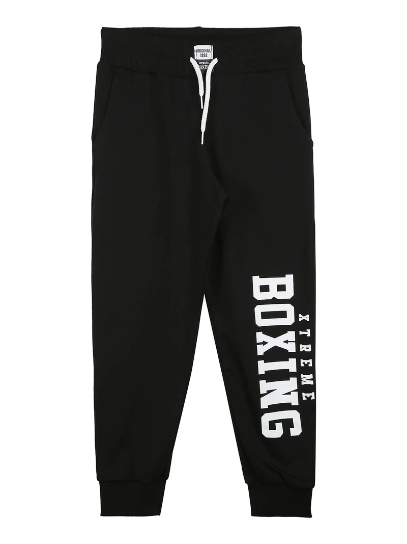 Pantaloni sportivi da ragazzo con coulisse e polsini - nero