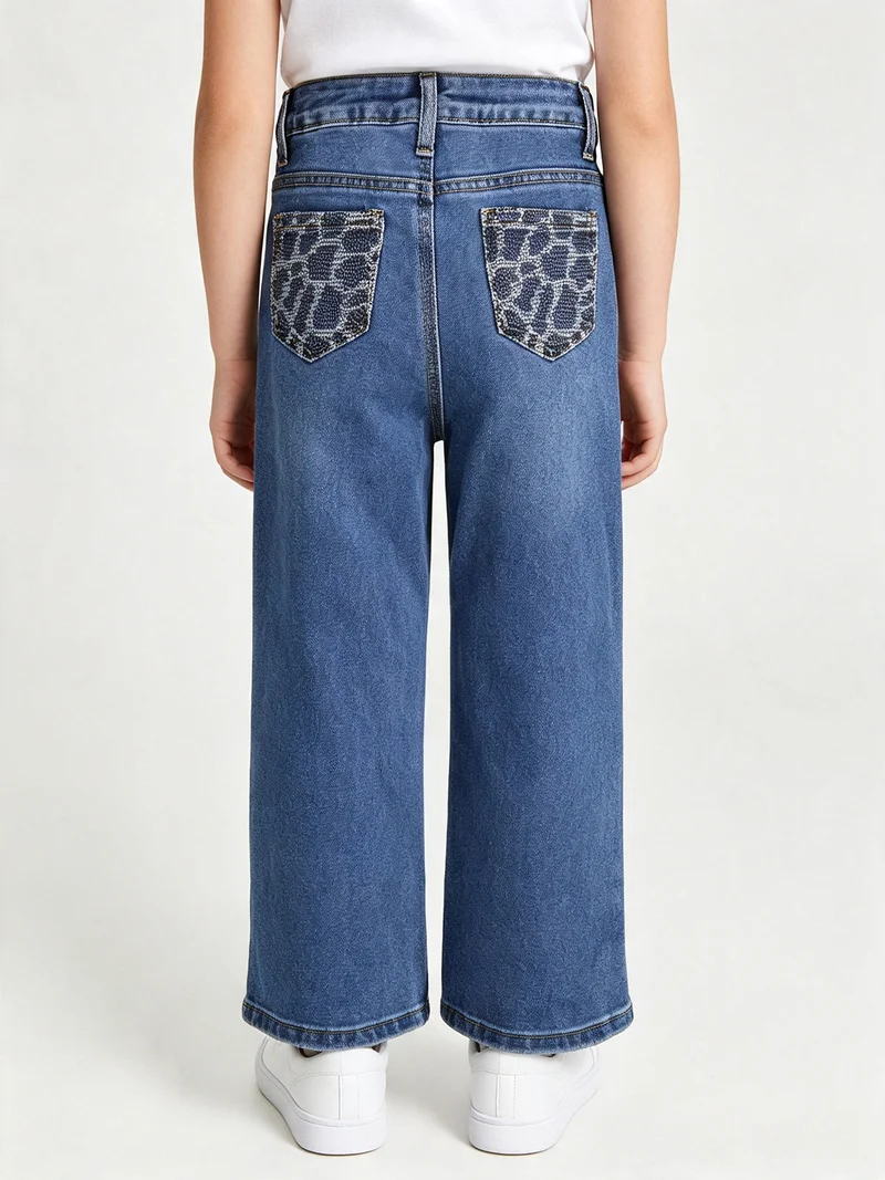 Jeans da bambina a gamba larga con strass sul retro - jeans