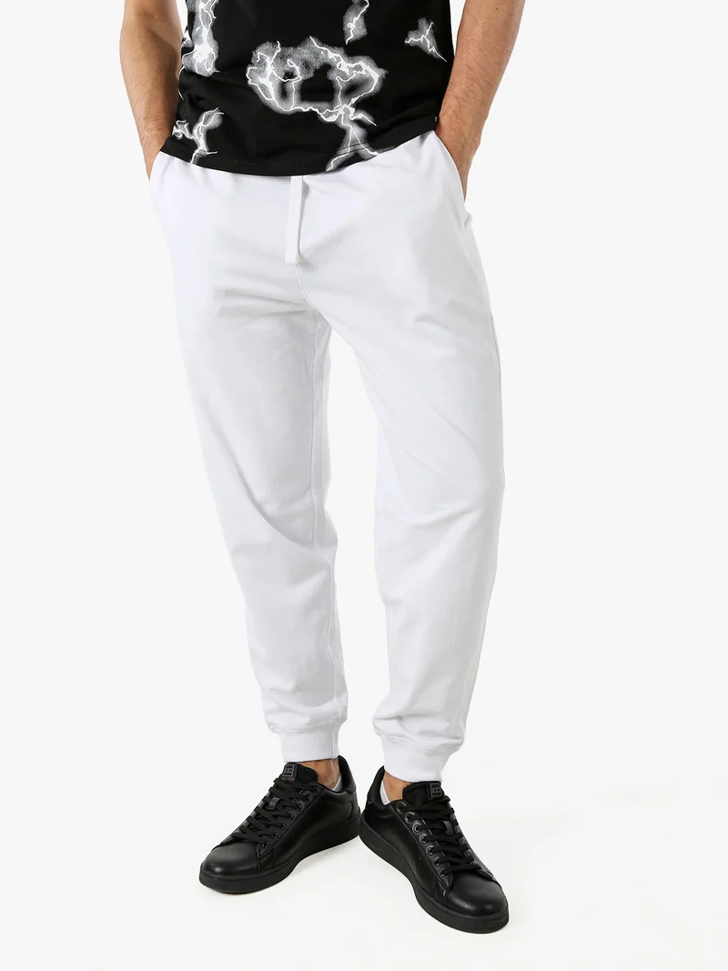 Pantaloni tuta da uomo con coulisse e polsini - bianco