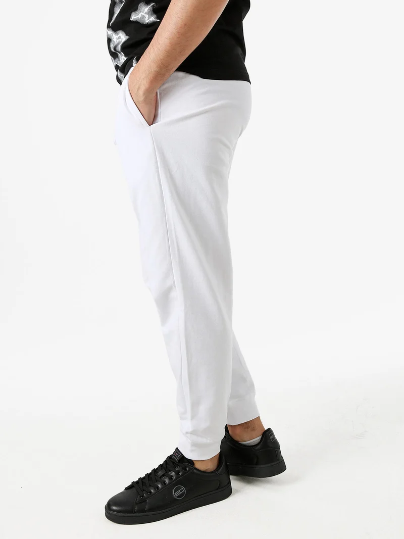 Pantaloni tuta da uomo con coulisse e polsini - bianco