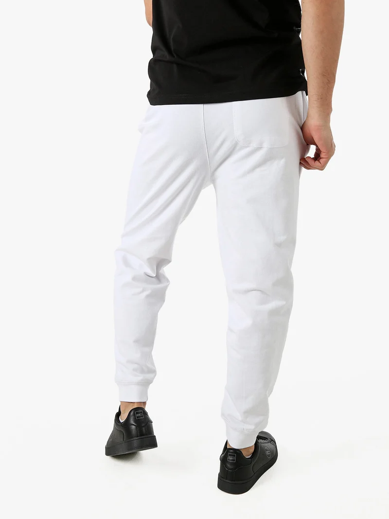 Pantaloni tuta da uomo con coulisse e polsini - bianco