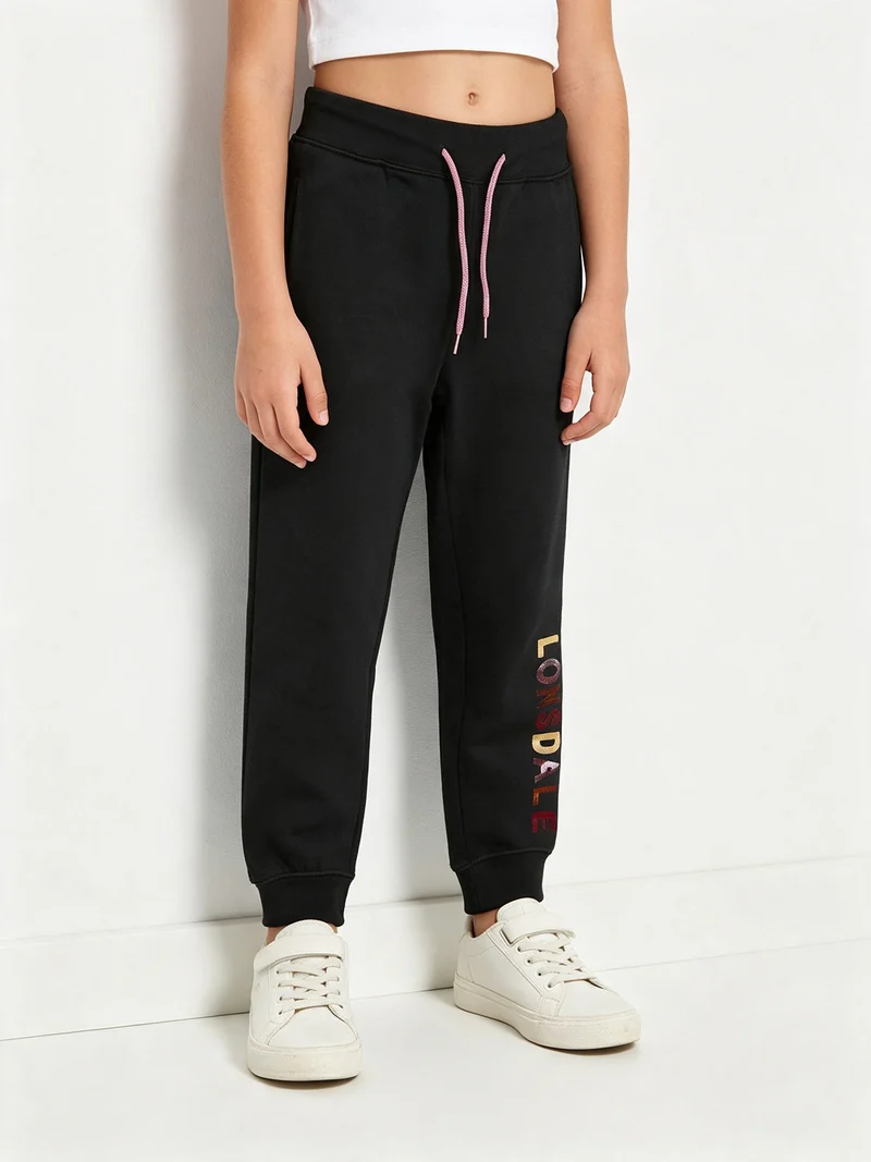 Pantaloni sportivi da bambina felpati con scritta sul fondo - nero