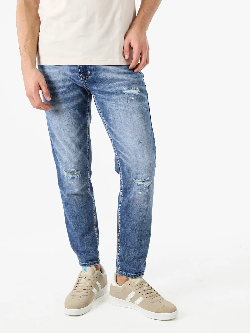 Jeans da uomo con strappi a vita bassa - jeans