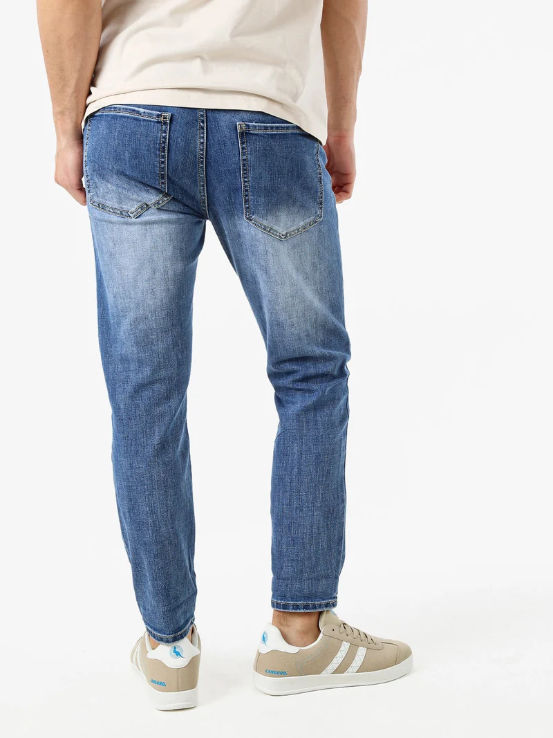 Jeans da uomo con strappi a vita bassa - jeans