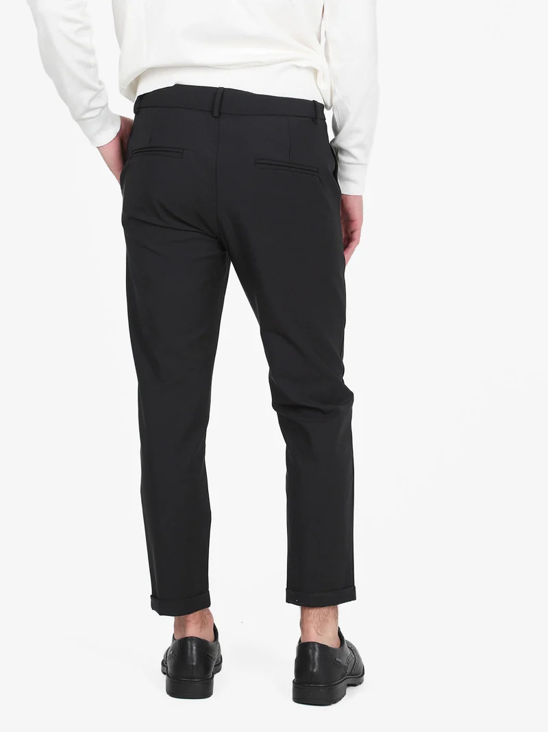 Pantaloni da uomo in tessuto tecnico con risvolto - nero