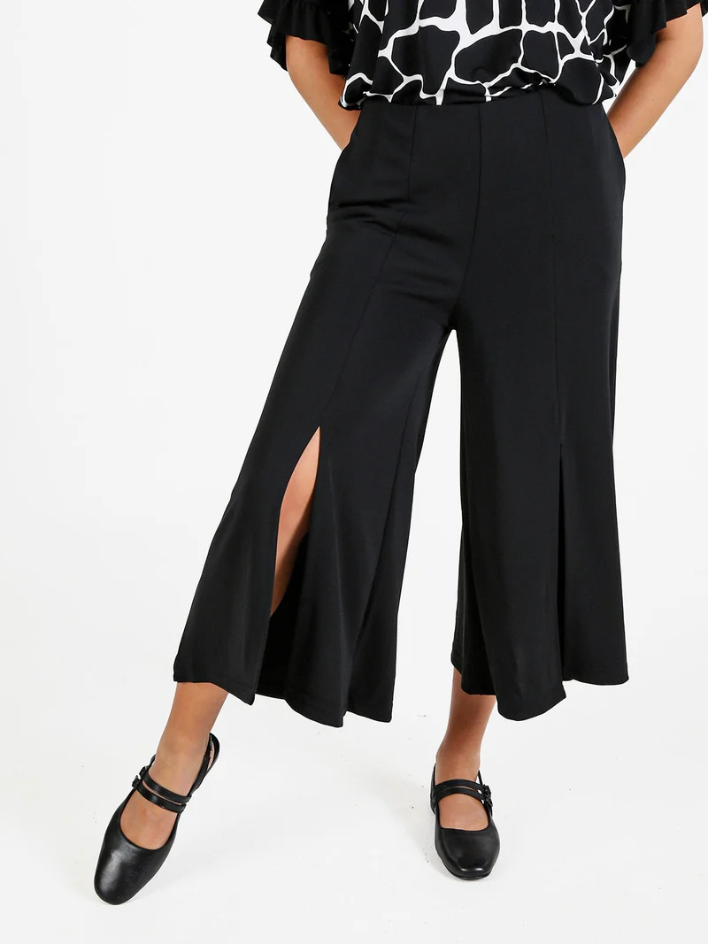 Pantaloni donna a gamba larga con spacco centrale - nero