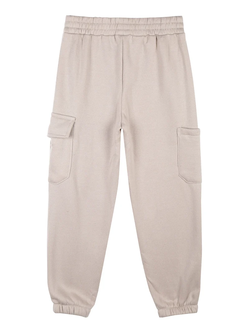 Pantaloni tuta da bambina felpati con tasconi laterali - beige