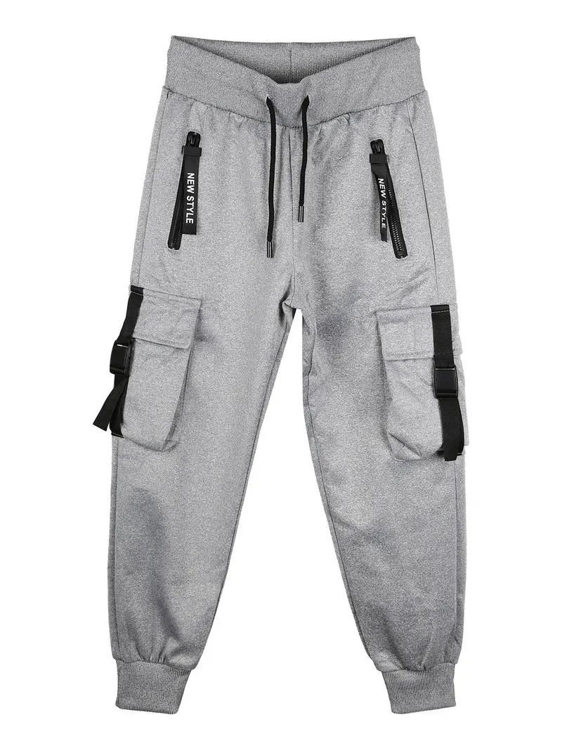 Pantaloni tuta da bambino con tasconi laterali e polsini - grigio