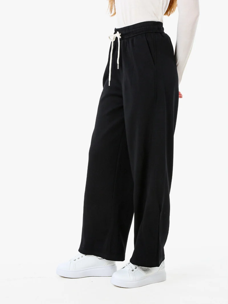 Pantaloni da donna in felpa a gamba larga con coulisse - nero