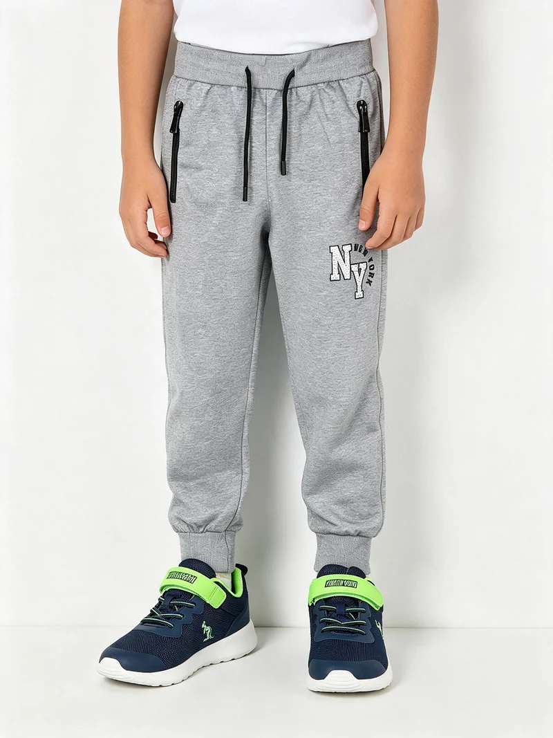 Pantaloni tuta da bambino con polsini e coulisse - grigio