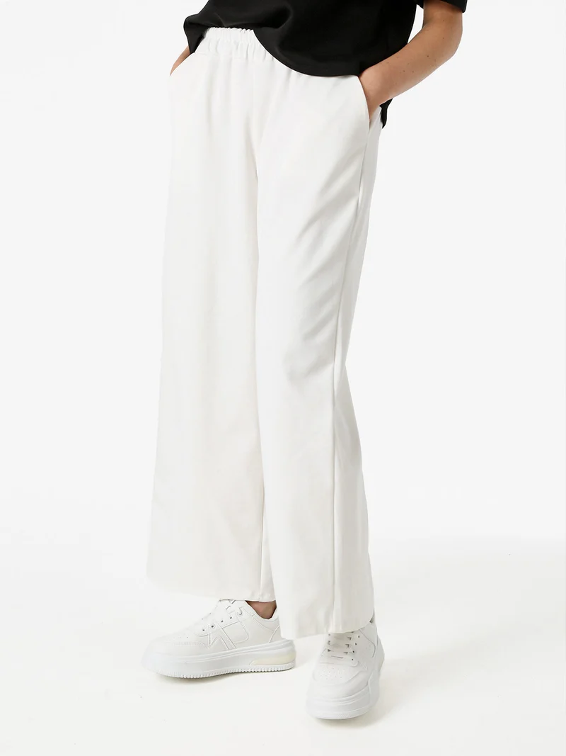 Pantaloni donna in felpa a gamba larga - bianco