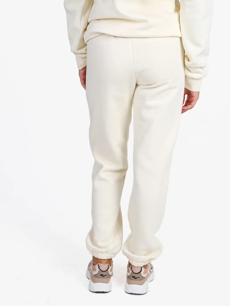 Pantaloni tuta da donna felpati con elastico finale - panna