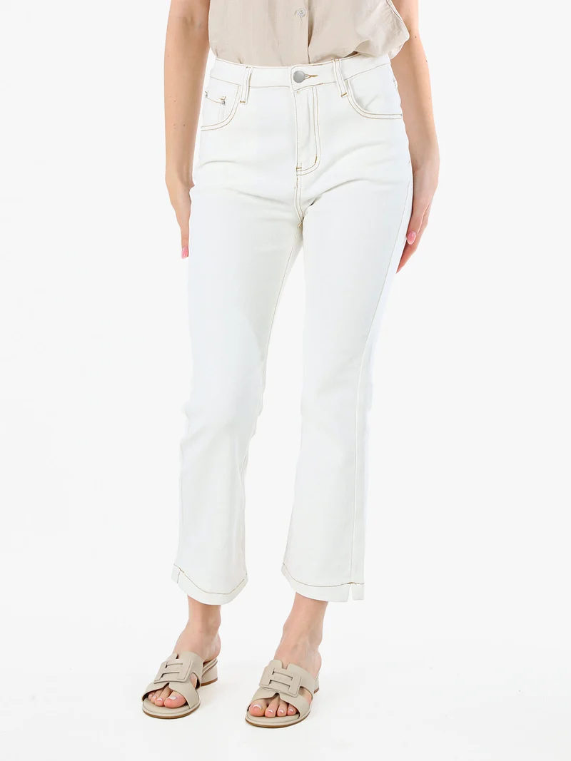 Pantaloni donna jeans cropped a zampa - panna