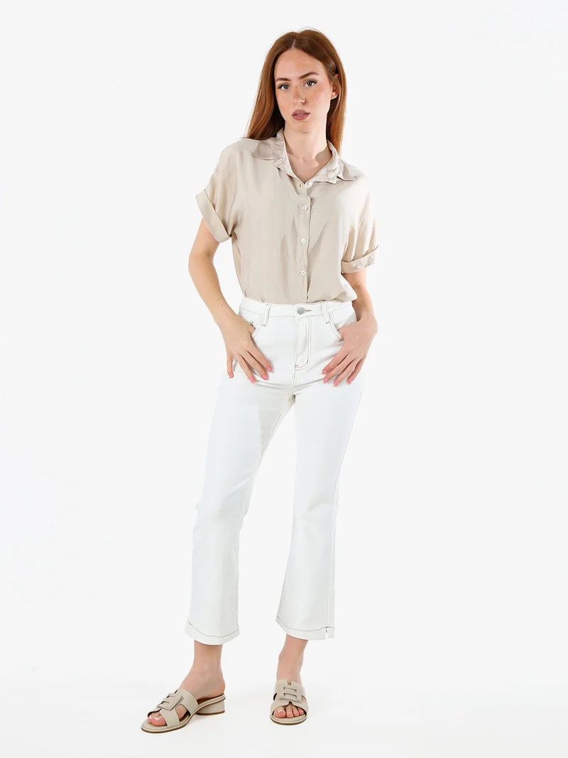 Pantaloni donna jeans cropped a zampa - panna