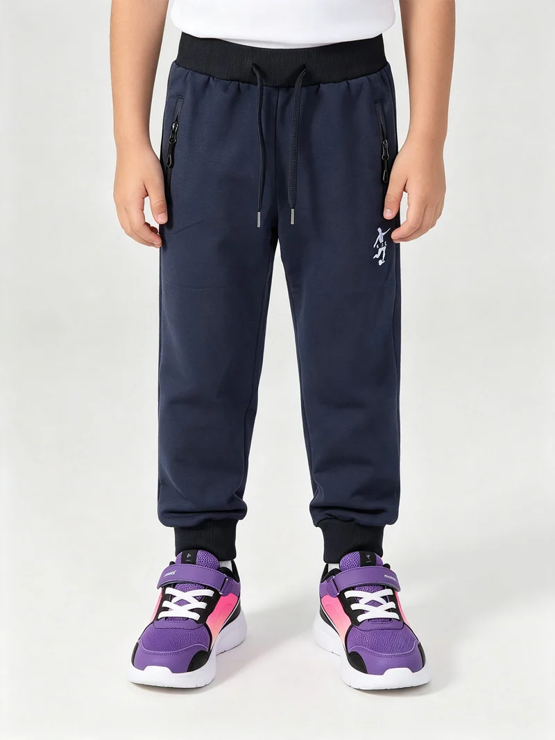 Pantaloni tuta da bambino con coulisse e polsini - blu scuro