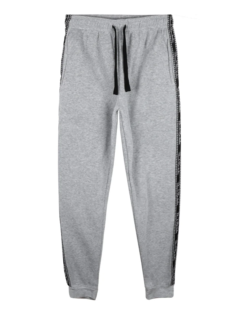 Pantaloni tuta da ragazzo felpati con striscia laterale - grigio